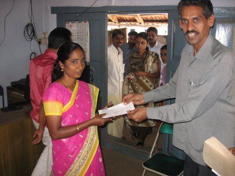 Figure 4	Mr Sathyan, General Manager of Finance for the Wildlife Trust of India handing over the Cheque to Mrs Sujata